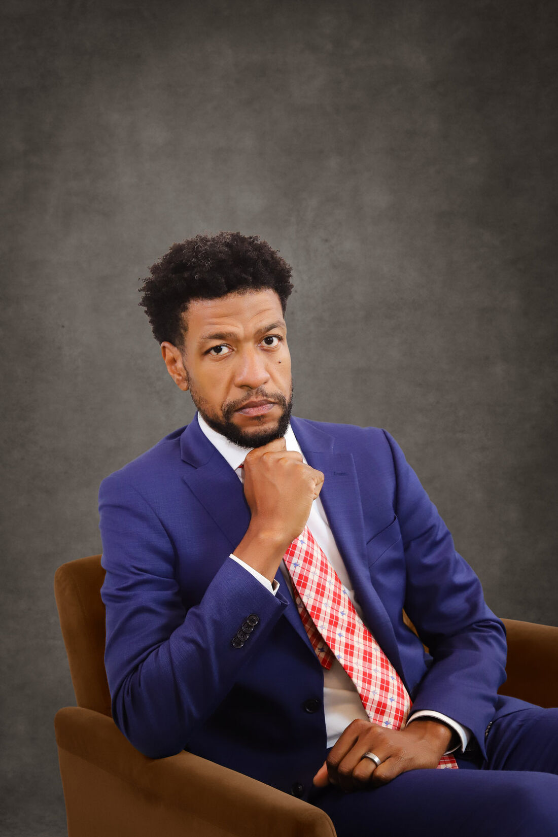 Jerome Matthews seated for a studio portrait